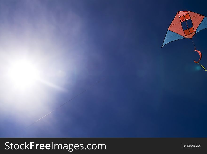 Kite in the blue sky (summer background)
