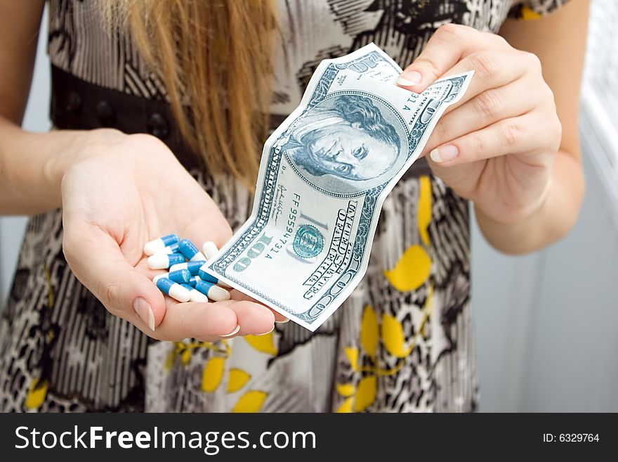 Medicine  capsules and money