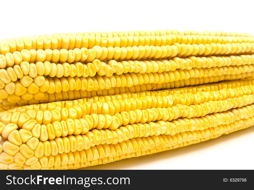 Fresh corn cobs detail on white background