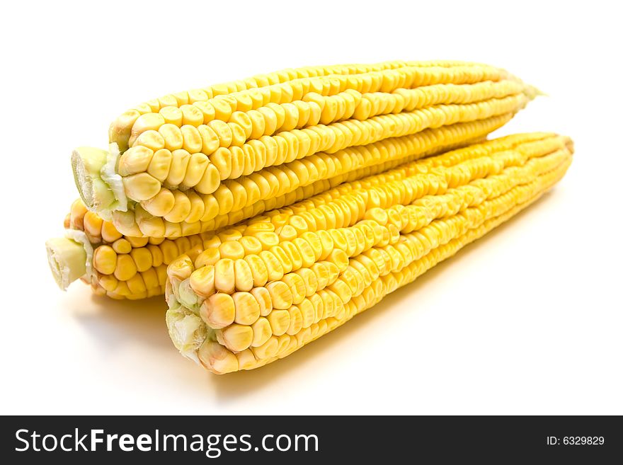 Three yellow corns isolated on white