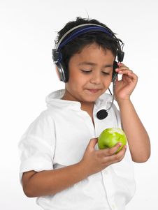Boy Biting Into A Green Apple Royalty Free Stock Photography Boy Biting Into A Green Apple Royalty Free Stock Photography