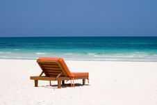 Bedchair Facing A Turquoise Sea Royalty Free Stock Image