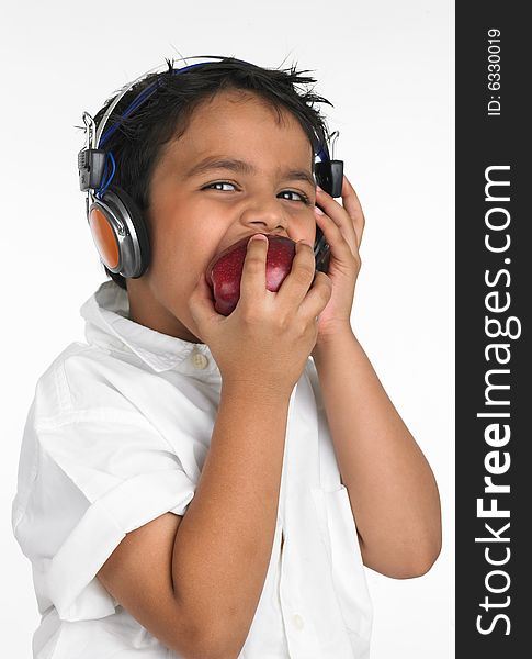 Asian Boy Biting An Apple