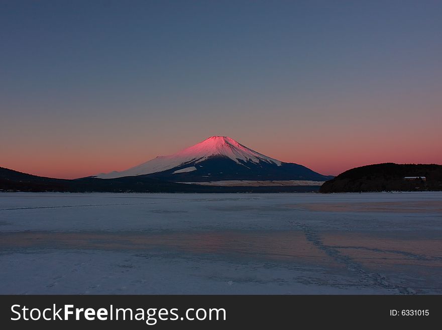 Fuji turning red in early winter morning, called red-Fuji. it isn't something we see every day. outside temp is -20　degrees at this time.　Lake Yamanaka is freeze-up. Fuji turning red in early winter morning, called red-Fuji. it isn't something we see every day. outside temp is -20　degrees at this time.　Lake Yamanaka is freeze-up.