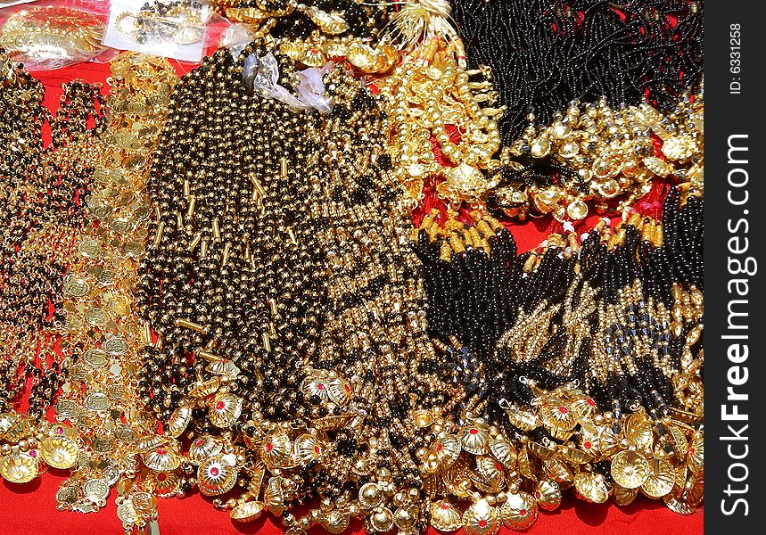 Typical Indian Jewelery made of black beads and gold called the Mangalsootra on sale