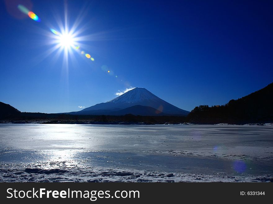 Mt. Fuji with the Sun. This photo is taken in the winter morning. Mt. Fuji with the Sun. This photo is taken in the winter morning.