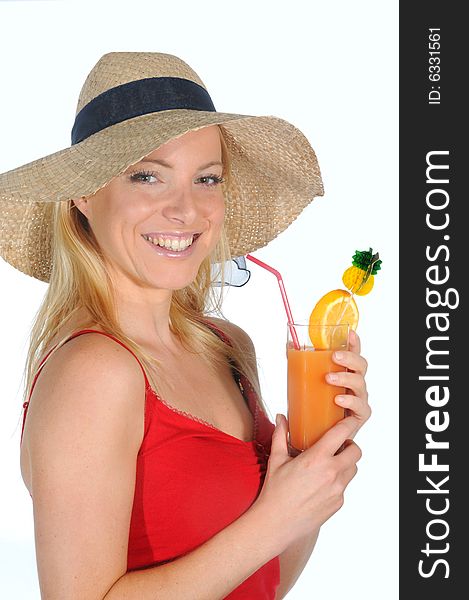 Young woman enjoying a long drink with straw.Wearing a straw hat. Young woman enjoying a long drink with straw.Wearing a straw hat.