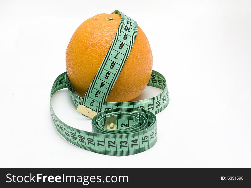 Orange with tape measure on white background