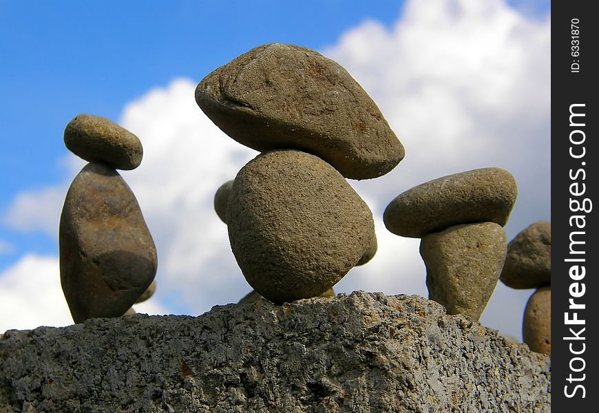 Figure from several stones on a sky background. Figure from several stones on a sky background