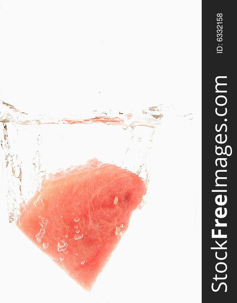 Watermelon splash in fresh water