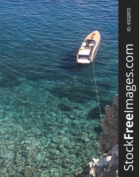 Top view of a ship anchored on clear sea. Top view of a ship anchored on clear sea