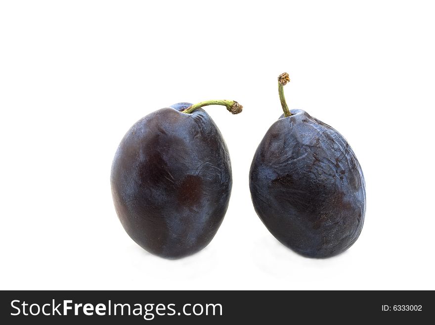 Fresh plums on white background