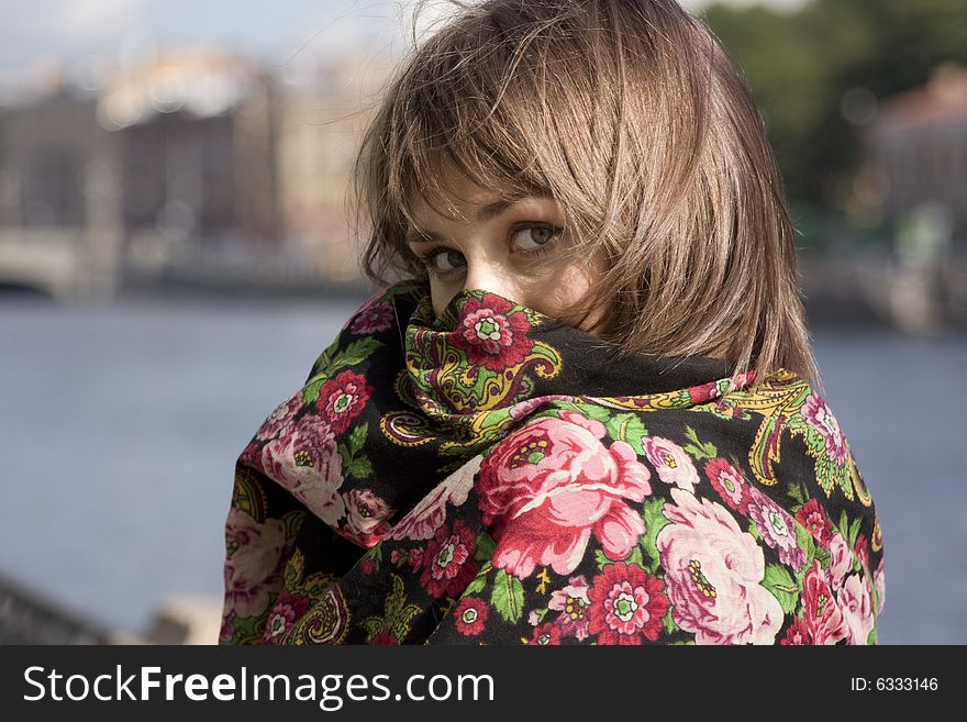 Portrait of young beautiful woman hiding in shawl. Portrait of young beautiful woman hiding in shawl