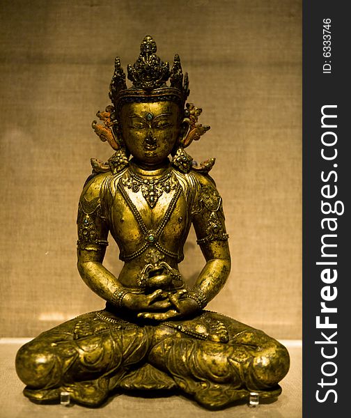 Peaceful sitting Buddha golden sculpture. Peaceful sitting Buddha golden sculpture