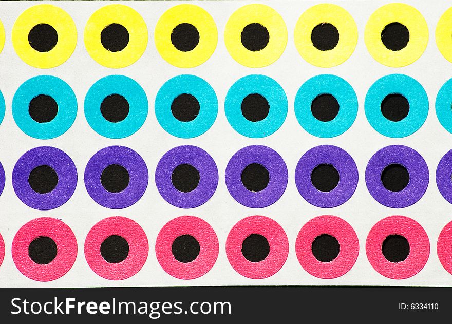 Colored paper hole reinforcements in various colors. Colored paper hole reinforcements in various colors