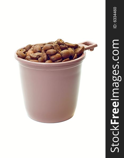 Cup with coffee beans on white