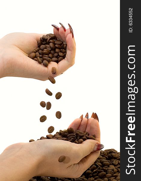 Female hands and coffee beans