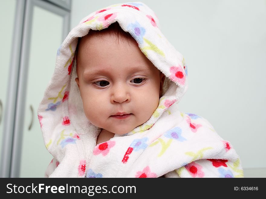 Little baby in dressing-gown before bath. Little baby in dressing-gown before bath.