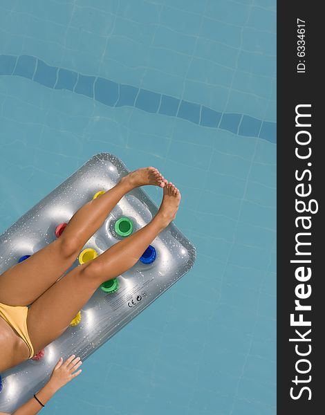 Young Woman Lying On Inflatable Sunbed