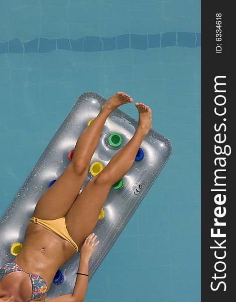 Young Woman Lying On Inflatable Sunbed