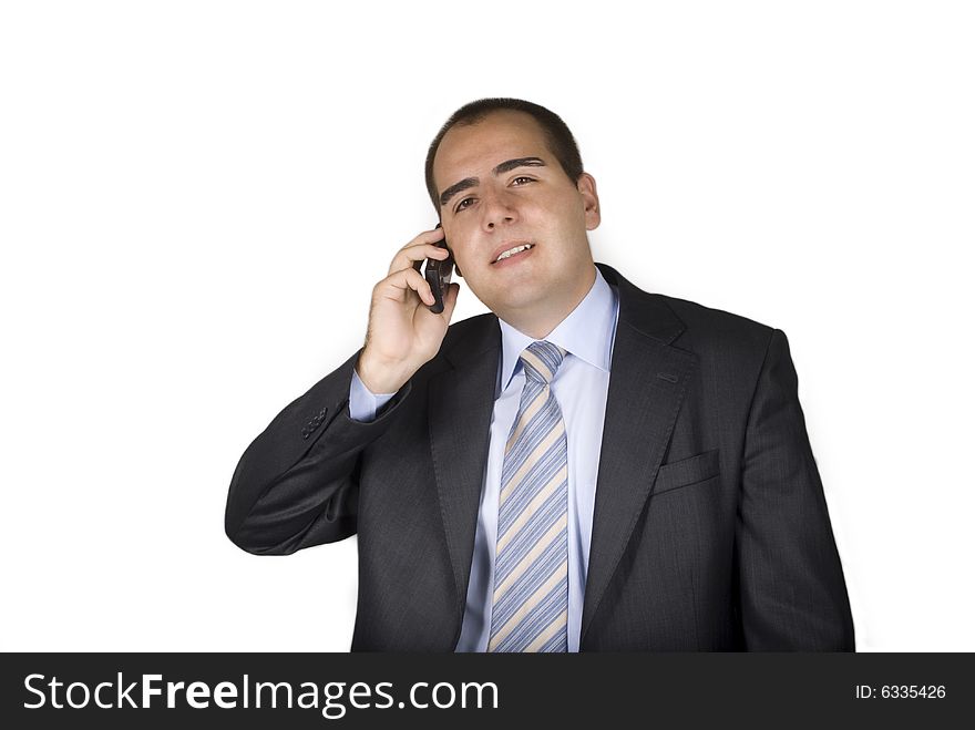 Businessman talking on a mobile phone and smiling isolated on a white background