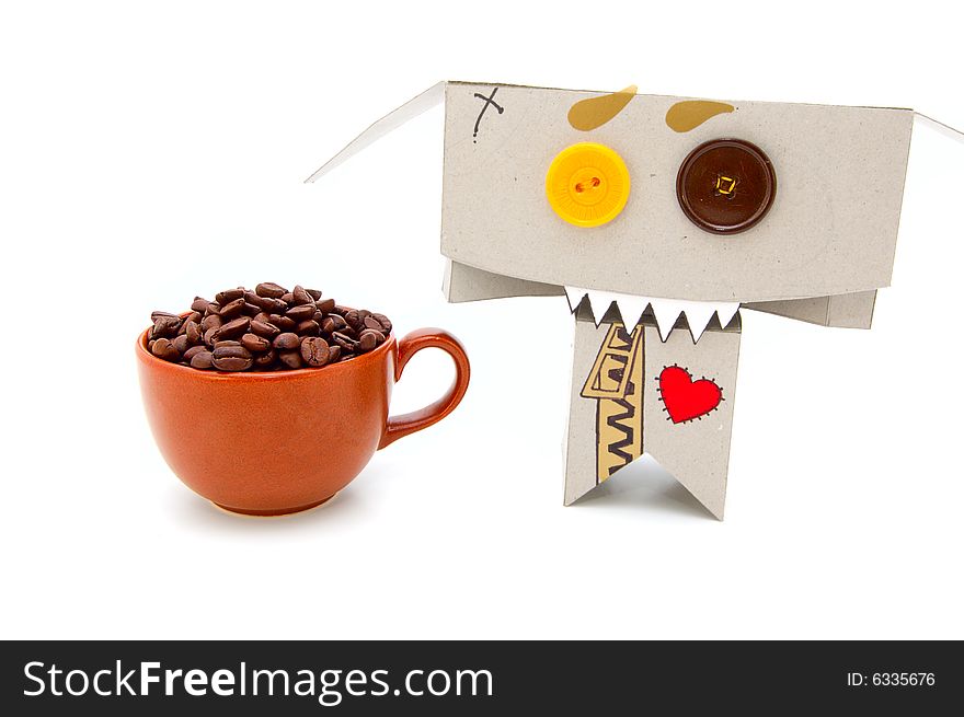 Addicted cardboard toy and cup of coffee beans. Addicted cardboard toy and cup of coffee beans