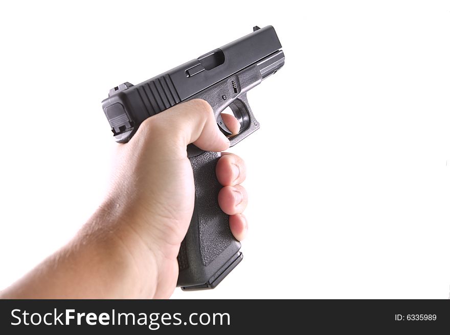 9mm handgun with a hand holding it on a white background. 9mm handgun with a hand holding it on a white background