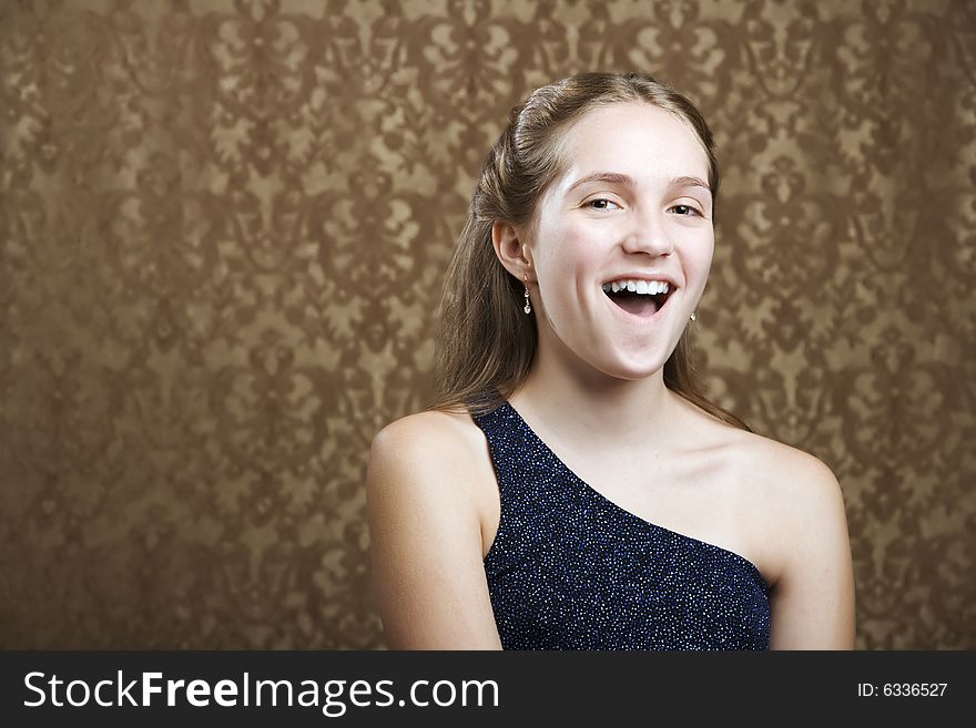 Confident Young Girl in a Party Dress Laughing. Confident Young Girl in a Party Dress Laughing
