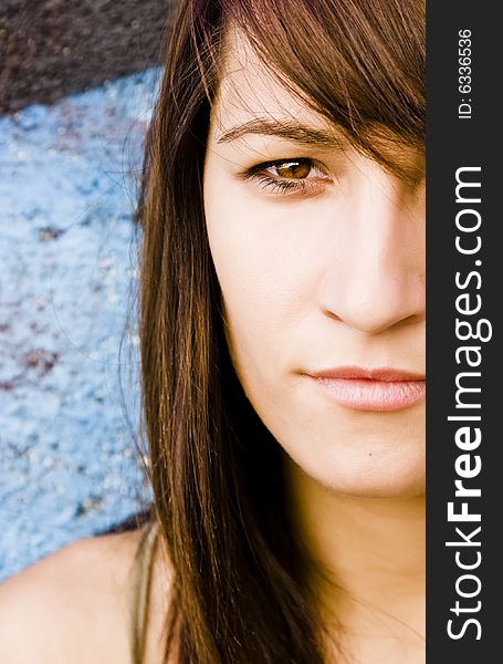 Half full portrait of a young long haired woman.