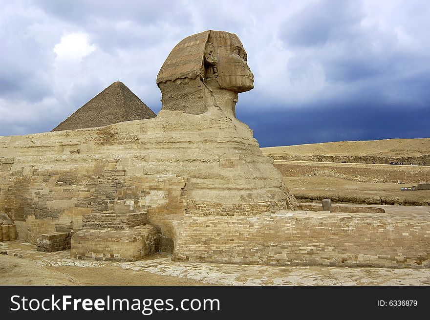 Sphinx in giza with a pyramid