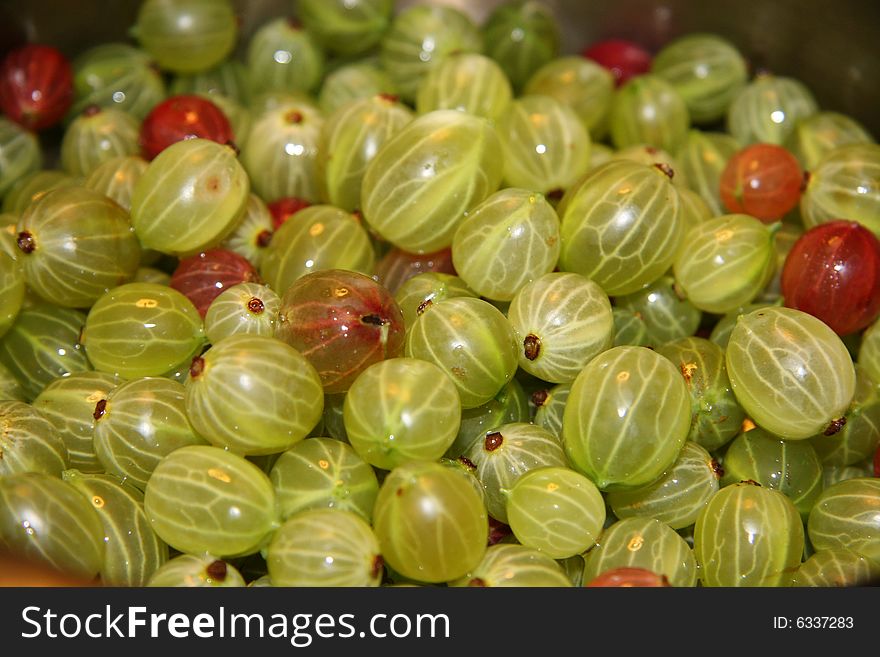 Berry (gooseberry) and drops of water