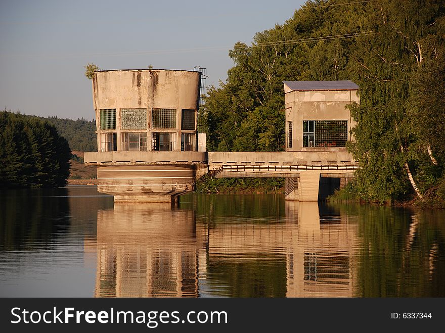 Landscape with an old water turbine on a lake in Romania