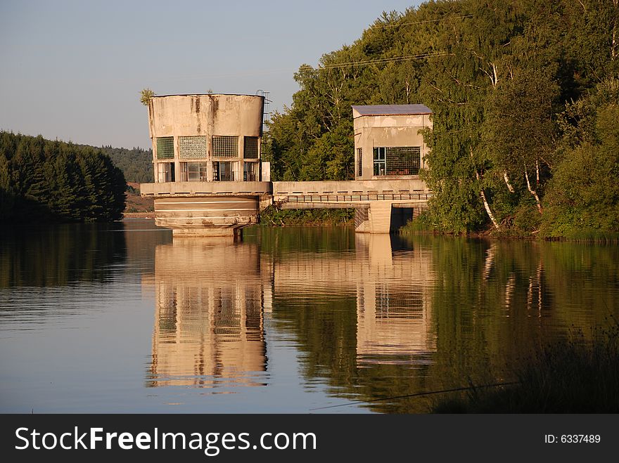 Landscape with an old water turbine on a lake in Romania