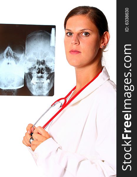 A beautiful young doctor with a red stethoscope and a xray image in the back. Isolated over white. A beautiful young doctor with a red stethoscope and a xray image in the back. Isolated over white.