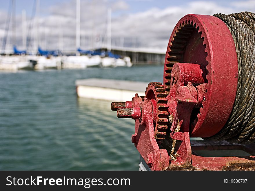 Striking dock winch with sailboats in the background