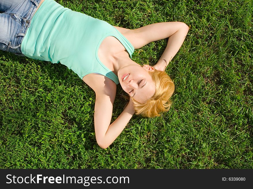 Sweet woman rest on the grass