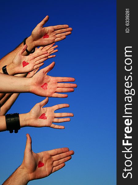 Shot of hands with drawn hearts on them. Shot of hands with drawn hearts on them