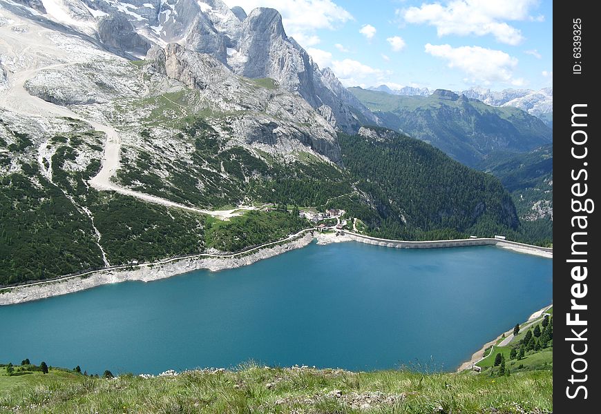Fedaia lake in the dolomites during summer