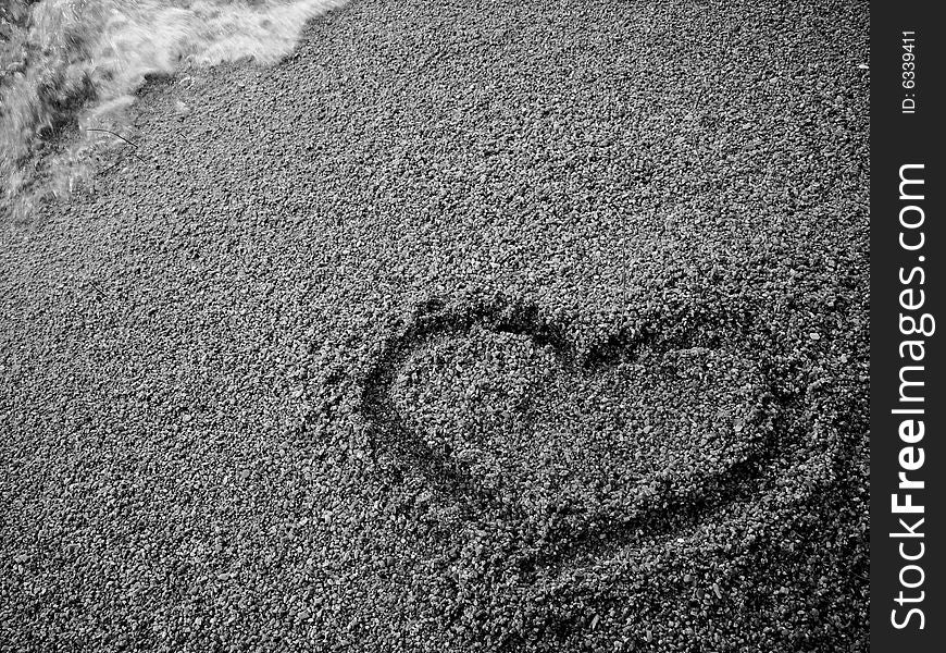 Heart draw on the sand. Heart draw on the sand