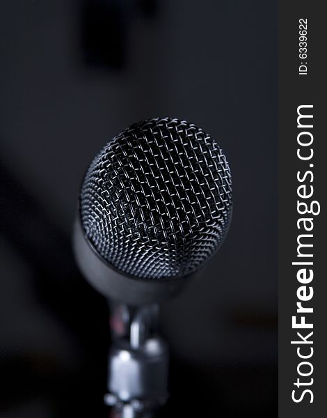 Isolated microphone windscreen on a dark background