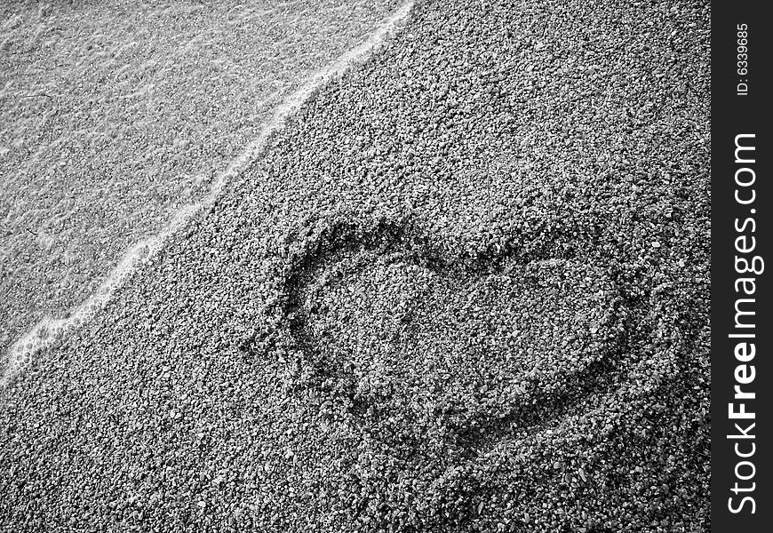 Heart draw on the sand. Heart draw on the sand