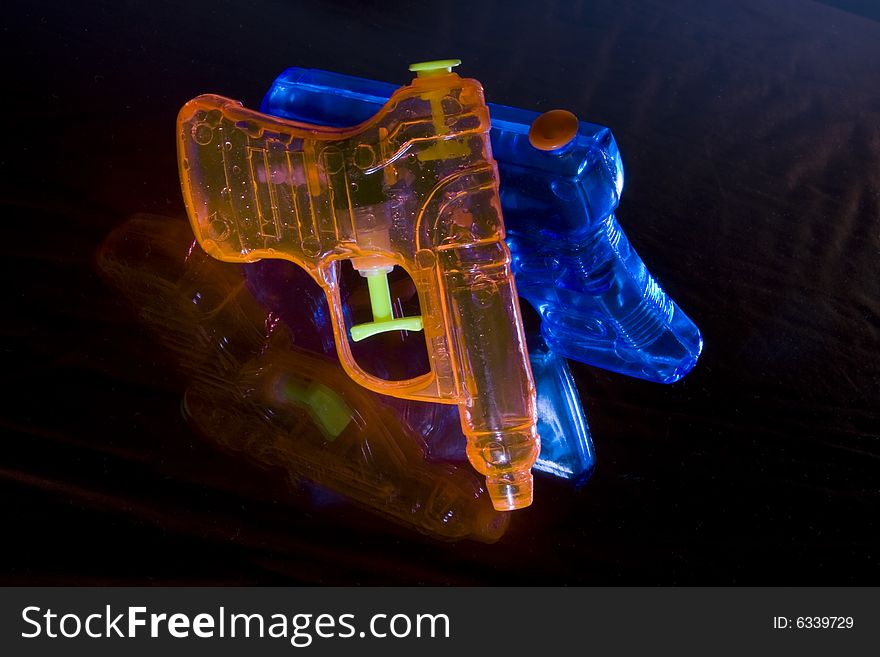 Orange and Blue Toy Water Pistols
