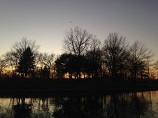Trees Reflecting In Water Surface During Sunset In Winter. Royalty Free Stock Photography Trees Reflecting In Water Surface During Sunset In Winter. Royalty Free Stock Photography