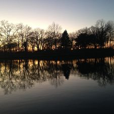 Trees Reflecting In Water Surface During Sunset In Winter. Royalty Free Stock Photography Trees Reflecting In Water Surface During Sunset In Winter. Royalty Free Stock Photography