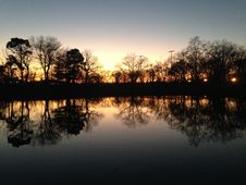 Trees Reflecting In Water Surface During Sunset In Winter. Royalty Free Stock Image Trees Reflecting In Water Surface During Sunset In Winter. Royalty Free Stock Image