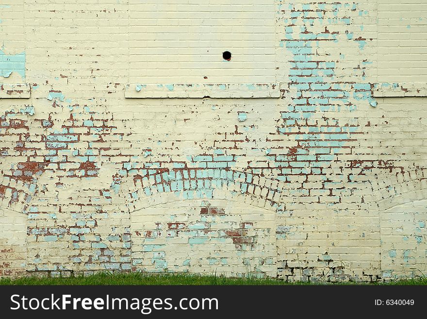 Close up of painted brick wall in weathered condition. Close up of painted brick wall in weathered condition.