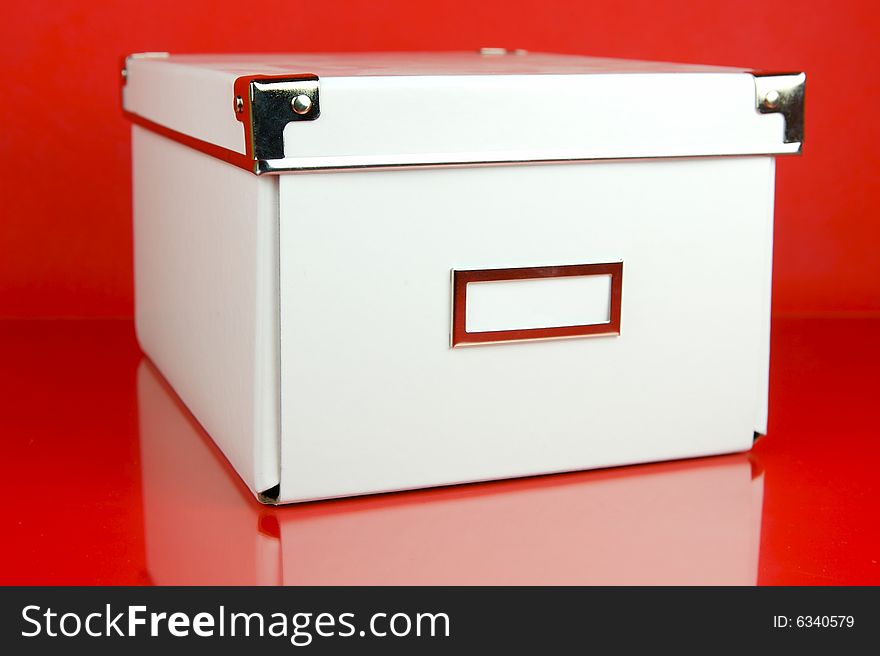 Storage boxes isolated against a red background