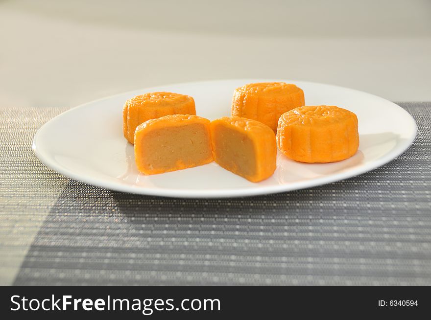 Pictures of orange and yellow skinned mooncakes. Picture here, ready to serve. Good for festival, asian and chinese contexts. Pictures of orange and yellow skinned mooncakes. Picture here, ready to serve. Good for festival, asian and chinese contexts.