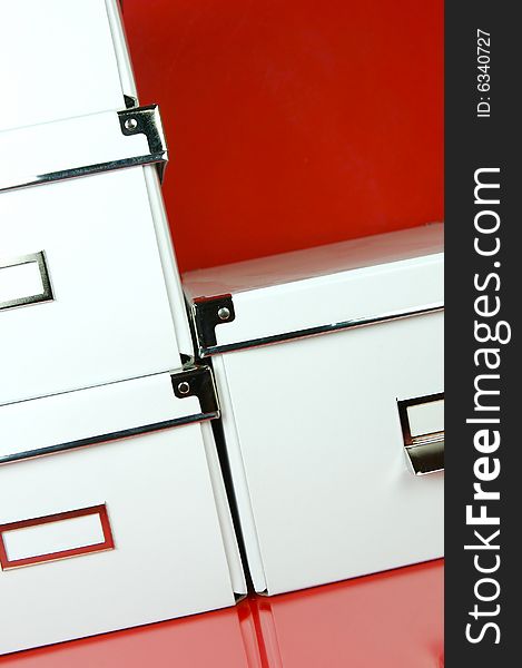 Storage boxes isolated against a red background