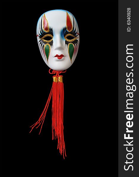 Nice ceramic venetian mask hanging on dark background